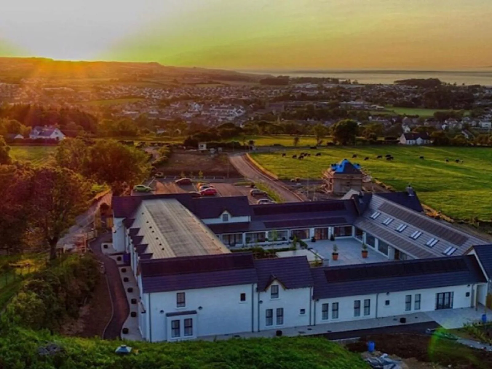 Aerial view of The Salthouse with commercial solar panels on its roofs